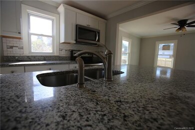large island has a sink and disposal! Dishwasher t