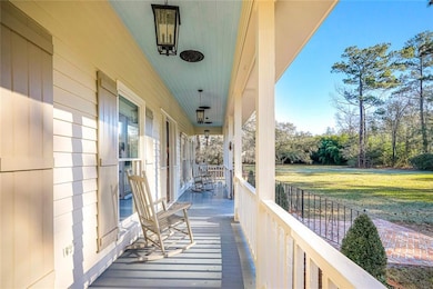 Front porch is width of home