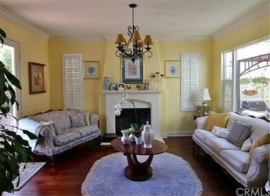 Elegant formal living room with a fireplace. Exten