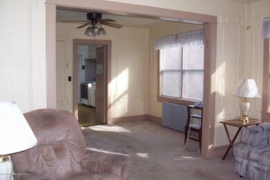 VIEW OF LIVING ROOM AND DINING ROOM