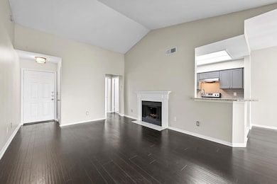 Unfurnished living room with a fireplace with flu