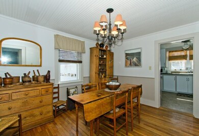 Dining room with view into the kitchen.