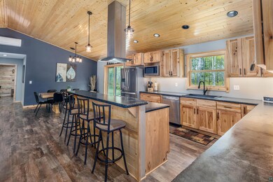 Kitchen featuring sink, decorative light fixtures,