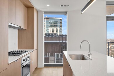 Kitchen featuring visible vents, modern cabinets,