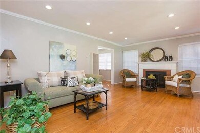 Living room with hardwood floors and a fireplace t