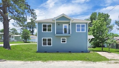 Side of home with balcony giving you a stunning vi