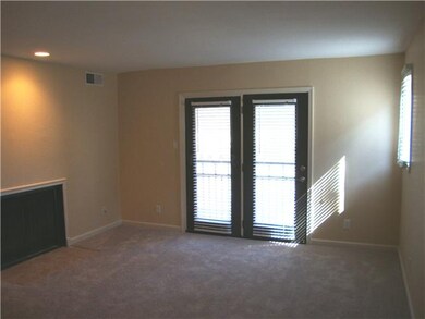 Living room offers plenty of sunlight as well as w
