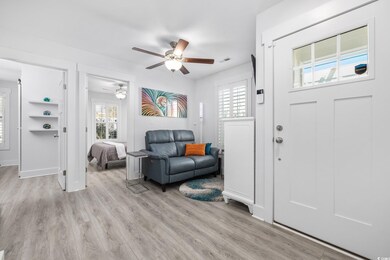 Foyer entrance with a ceiling fan, visible vents, 