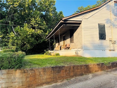 View of property exterior featuring a yard