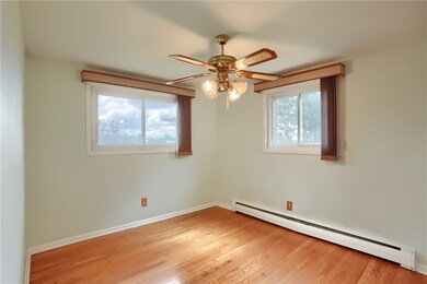 The charming dining room has custom blinds, a ceiling fan and access to the chef’s kitchen.