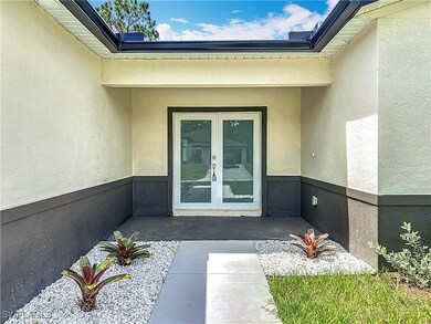 Doorway to property with french doors and stucco s