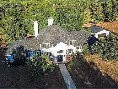 Beautiful 18.22-acre estate featuring main home, p