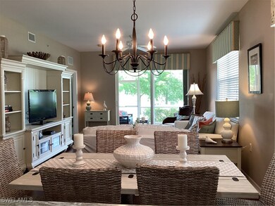 Living room with wood-type flooring and a chandeli