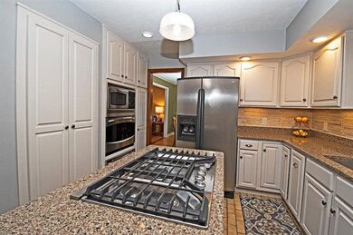 This lovely kitchen has spacious cabinetry and bui