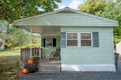 Large, paved driveway leads directly to the front 