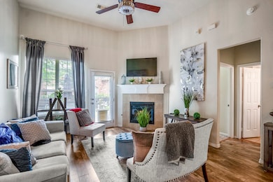 The living area features soaring ceilings allowing