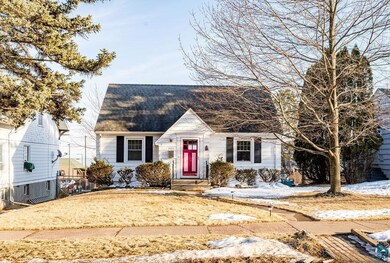 Cape cod home with a shingled roof