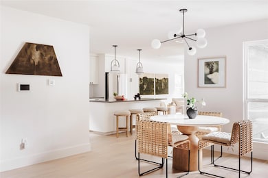 Dining space with light wood-style flooring and a