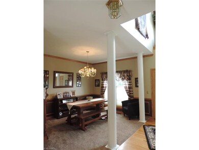 Dining room flanked with pillars.  A great space f