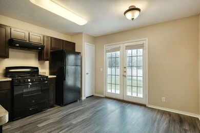 Kitchen featuring black appliances, under cabinet