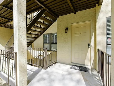 Entrance to property featuring stucco siding