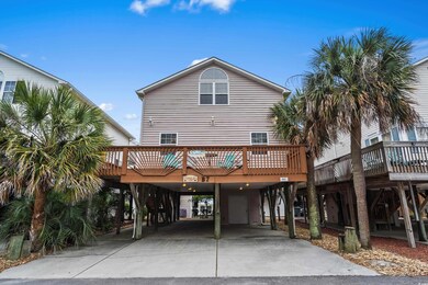 View of front of house featuring a carport, drivew
