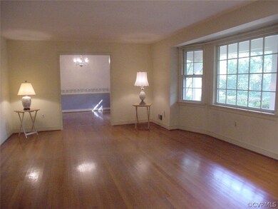 Living room has walkout bay window & wide opening