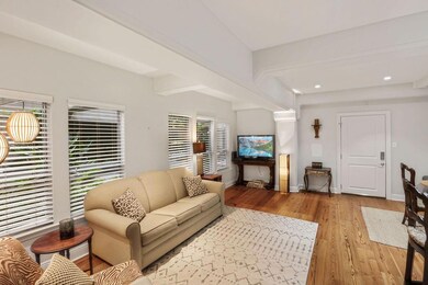 Furnished living room w/ cypress floors