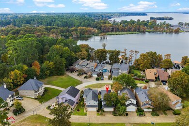 Aerial perspective of suburban area with a large body of water
