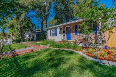 Freshly landscaped with new fence, brick walkway a