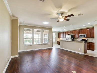 Kitchen with ceiling fan, tasteful backsplash, sta