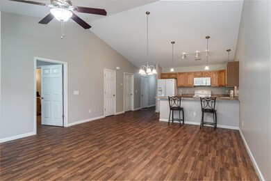 Living & Dining areas have high vaulted ceilings.