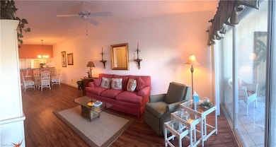 Living room featuring dark hardwood / wood-style f
