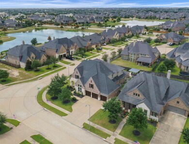 You'll love the amazing open floor plan between the living room, dining, and kitchen. There are an abundance of features including gorgeous wood floors, modern finishes, sky high ceilings in the living area with stunning dark wood beams, granite countertops, stainless steel appliances, elegant staircase with wrought iron railing, beautiful stone fireplace, spacious master suite, and so much more!