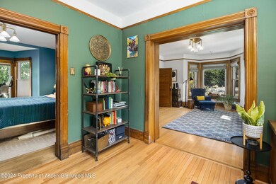 den off living room and primary bedroom