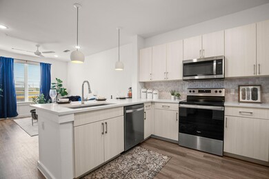 Kitchen featuring appliances with stainless steel