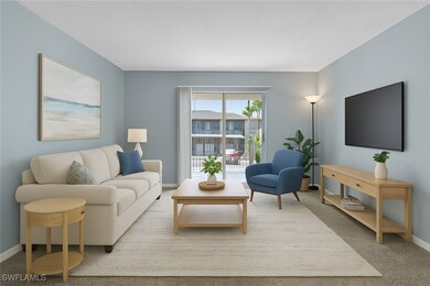 Carpeted living area with baseboards
