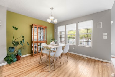 Dining space featuring lots of natural light and wood finishes.