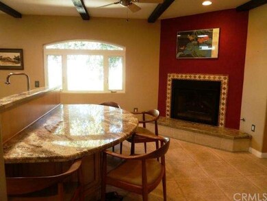 Granite island breakfast bar and kitchen fireplace