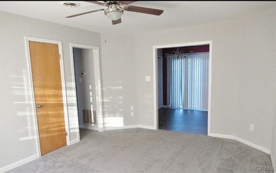 Unfurnished bedroom featuring carpet, visible vent