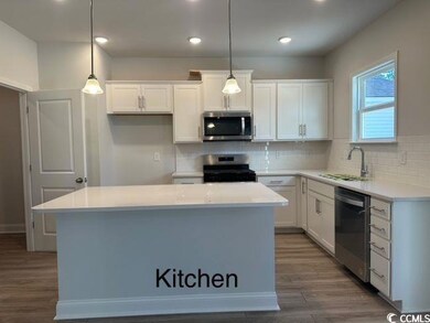 Kitchen with appliances with stainless steel finis