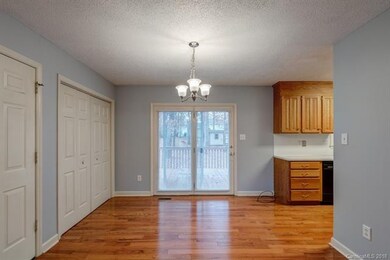 Dining/Kitchen with access to deck.
