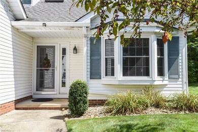 A bay window gives the home charm.