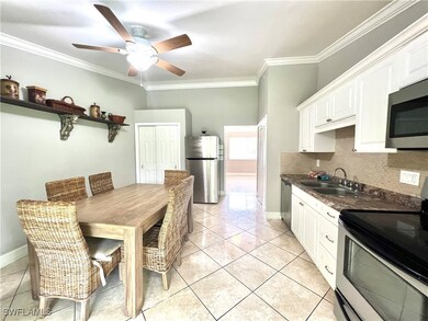 Kitchen featuring stainless steel appliances, back