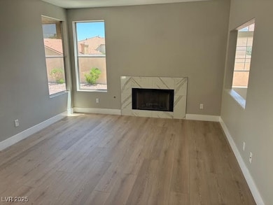 Unfurnished living room with wood finished floors