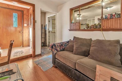 Living room with hardwood / wood-style floors