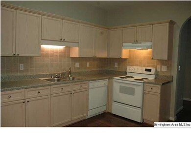 Beautiful kitchen with tile backsplash and hardwoo