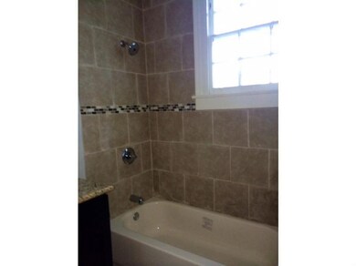 Photo. All new tile bathrooms with modern glass si
