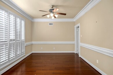Formal Dining Room to left of entry; Plantation Shutters on windows facing front of home.