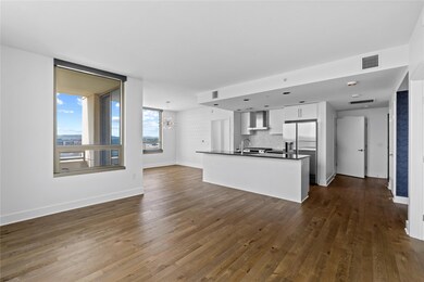 Unfurnished living room with dark wood-type floor